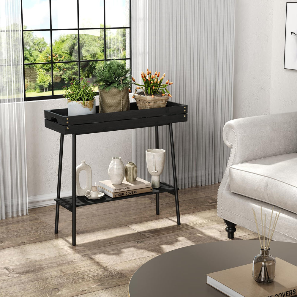 BAMBANG plant stand beside potted plant for scale, shows compact footprint benefit