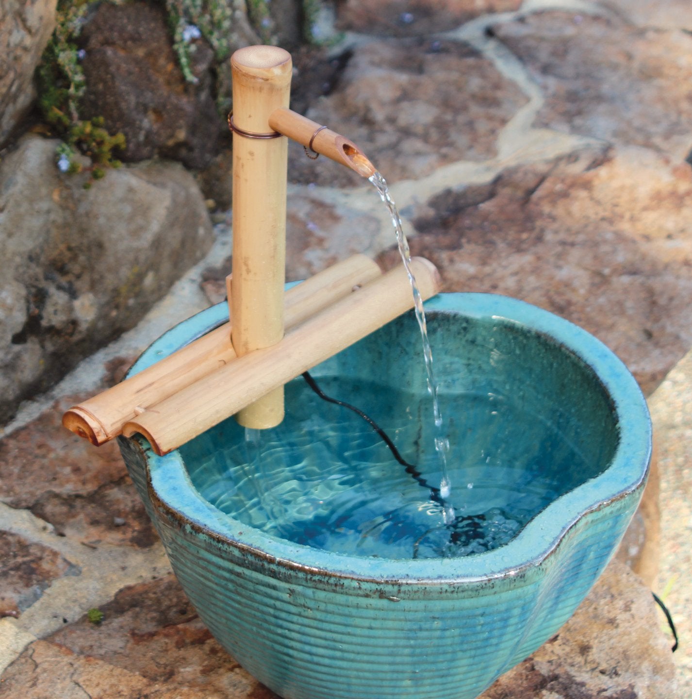 Bamboo Accents installed in a patio basin showing ambient sound benefit
