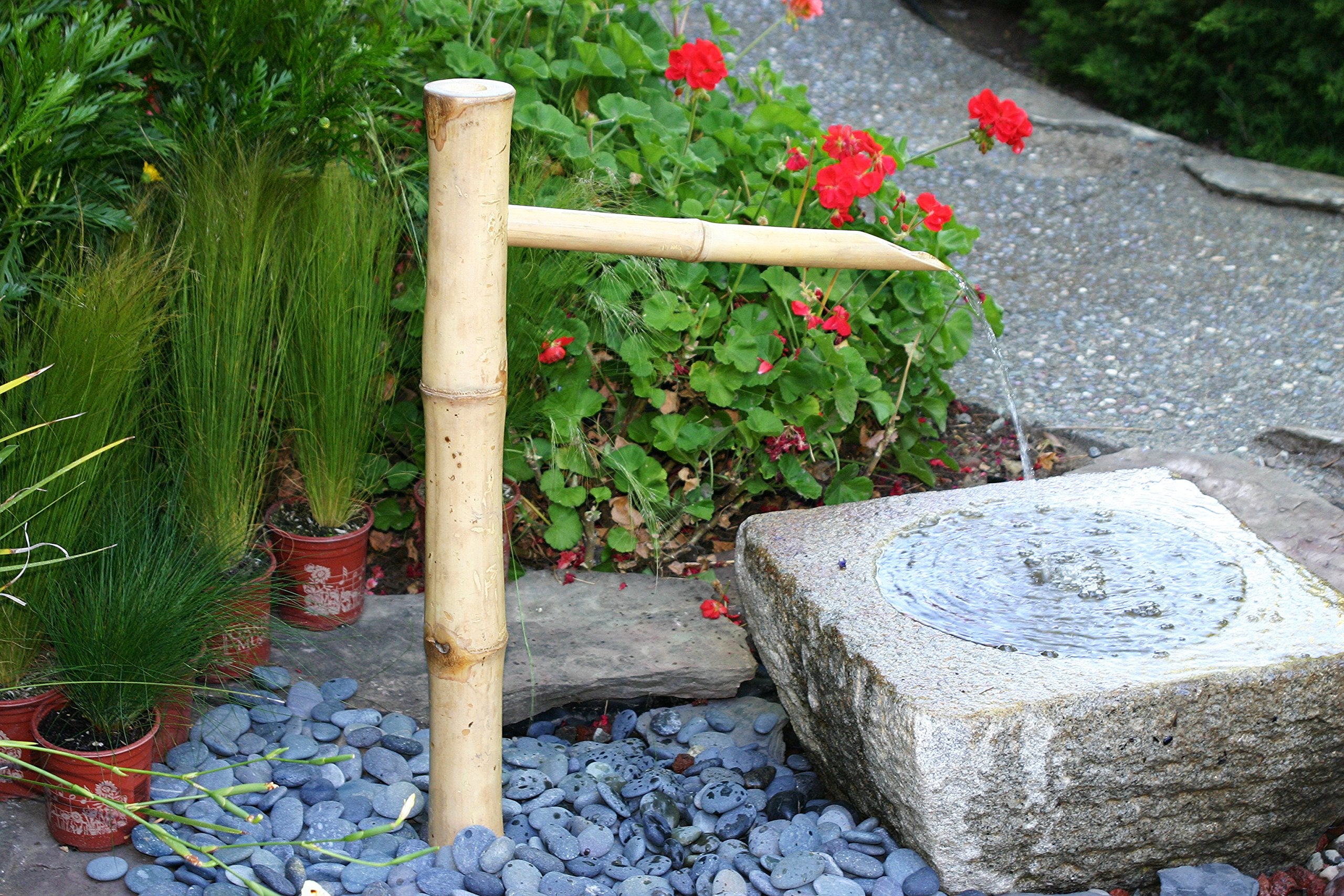 Bamboo Accents illuminated at night highlighting waterfall glow and ambiance benefit