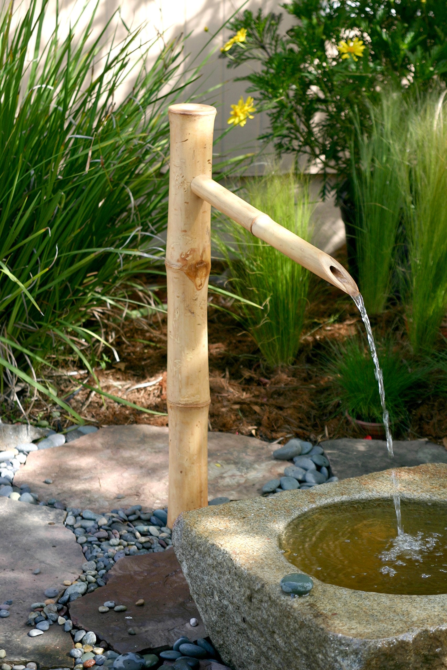 Bamboo Accents spout integrated with stone and gravel in a styled garden benefit