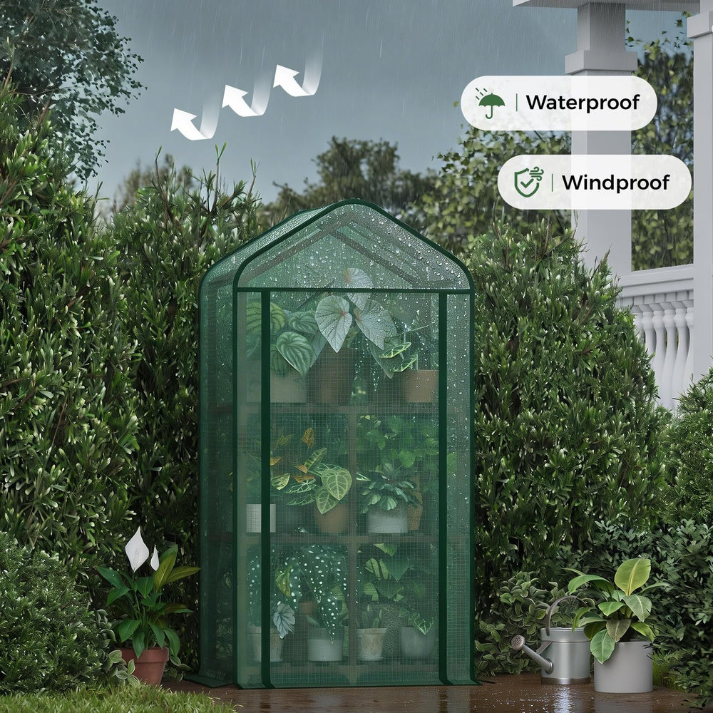 Bamworld greenhouse on a balcony with potted herbs benefiting from protected warmth
