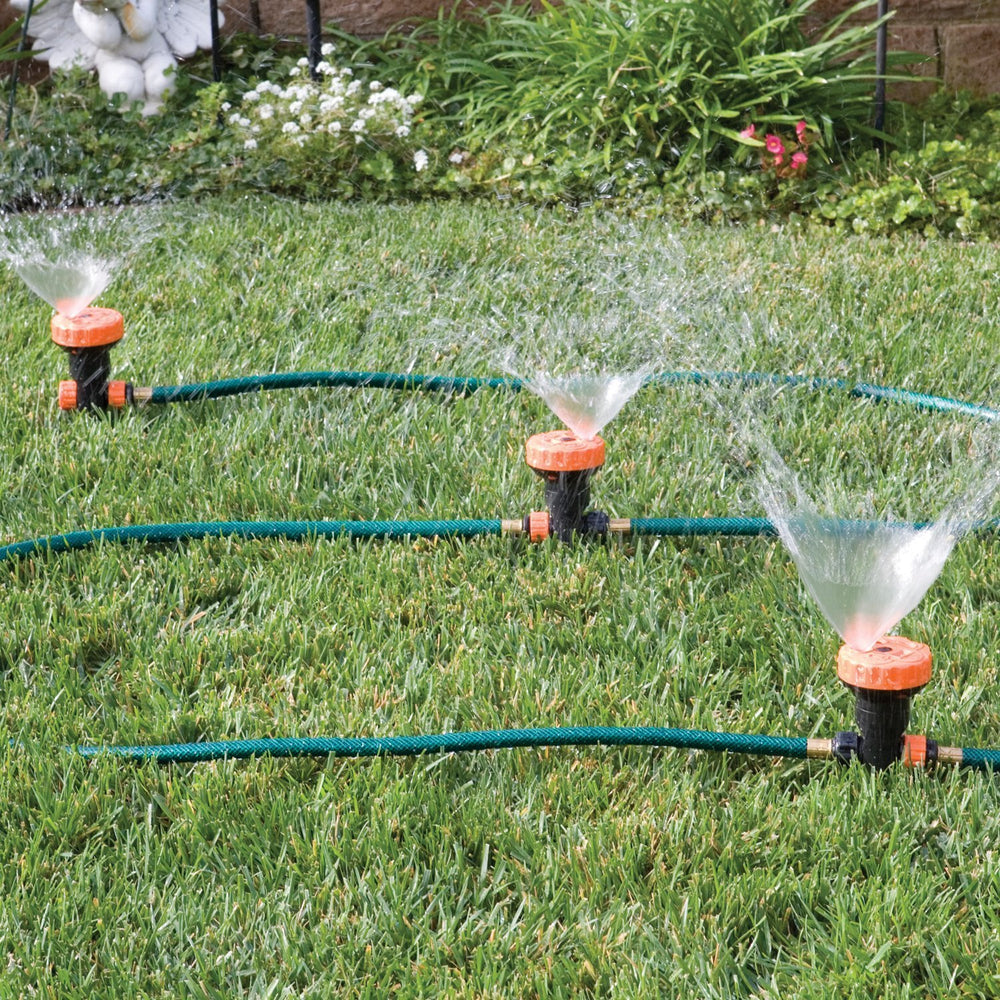 Bandwagon front view of assembled three-head sprinkler showing coverage and easy setup benefit