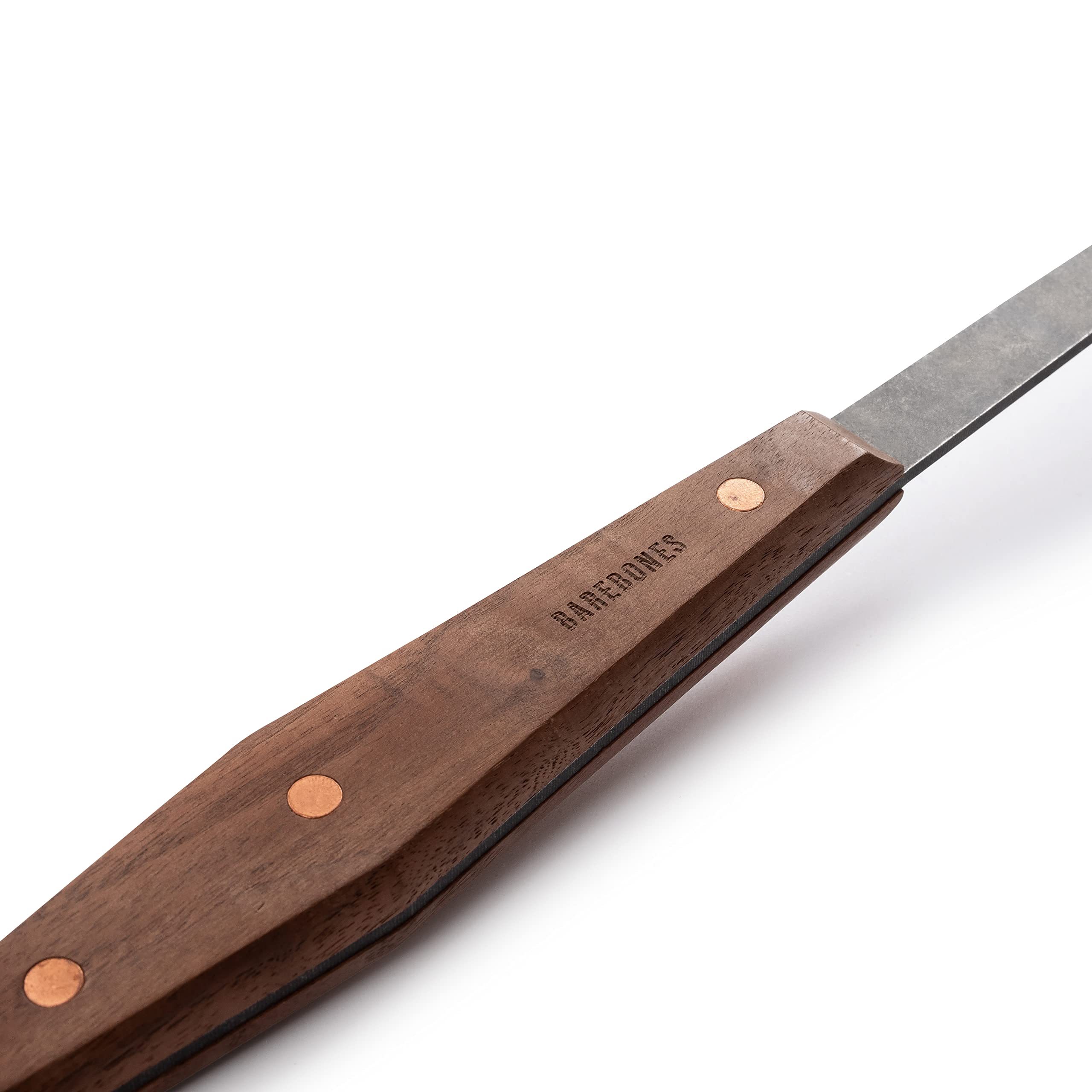 Barebones shovel hung on Cowboy Grill demonstrating integrated storage and convenience