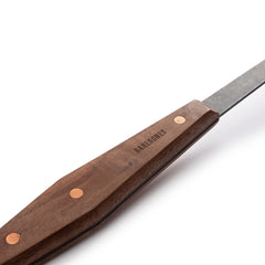 Barebones shovel hung on Cowboy Grill demonstrating integrated storage and convenience