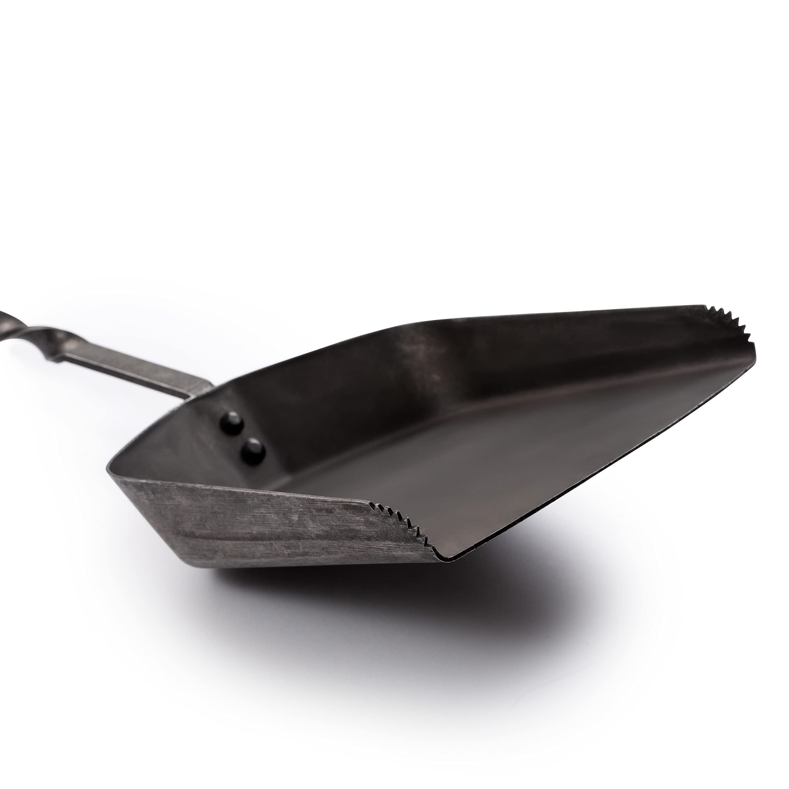Barebones shovel in use moving coals to redistribute heat quickly and safely