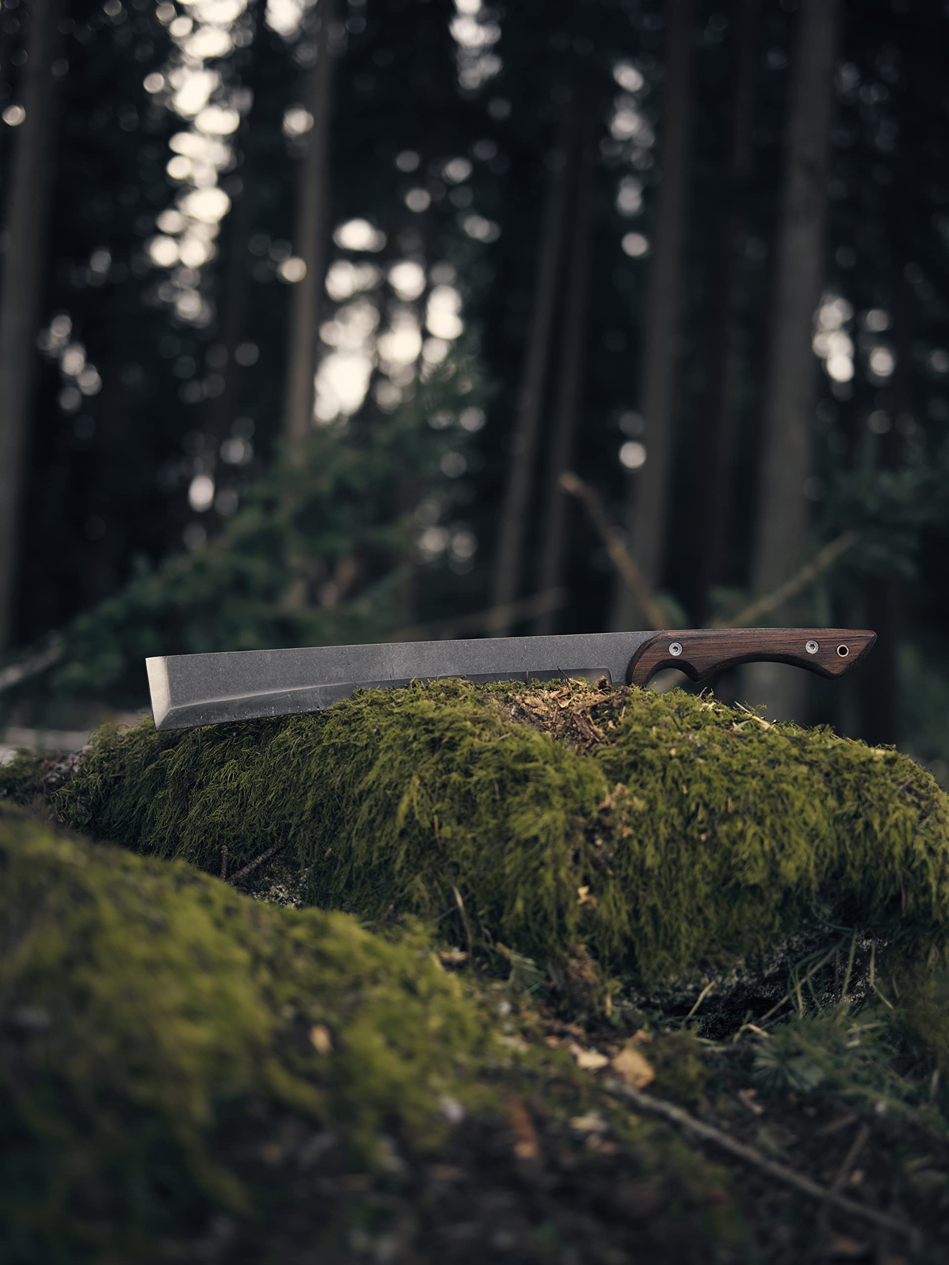 Barebones NATA by a campfire showing versatile outdoor chopping utility