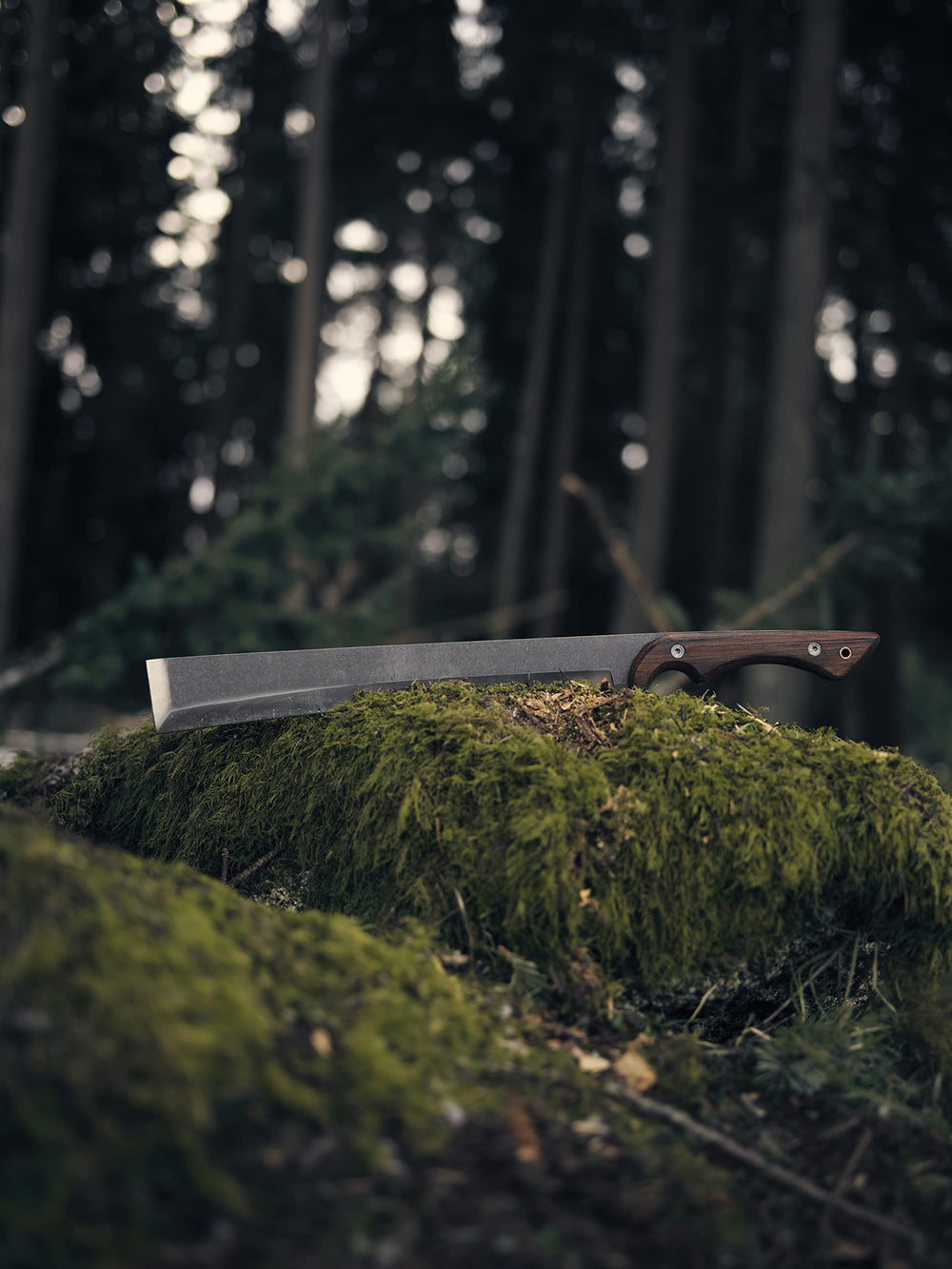 Barebones NATA by a campfire showing versatile outdoor chopping utility