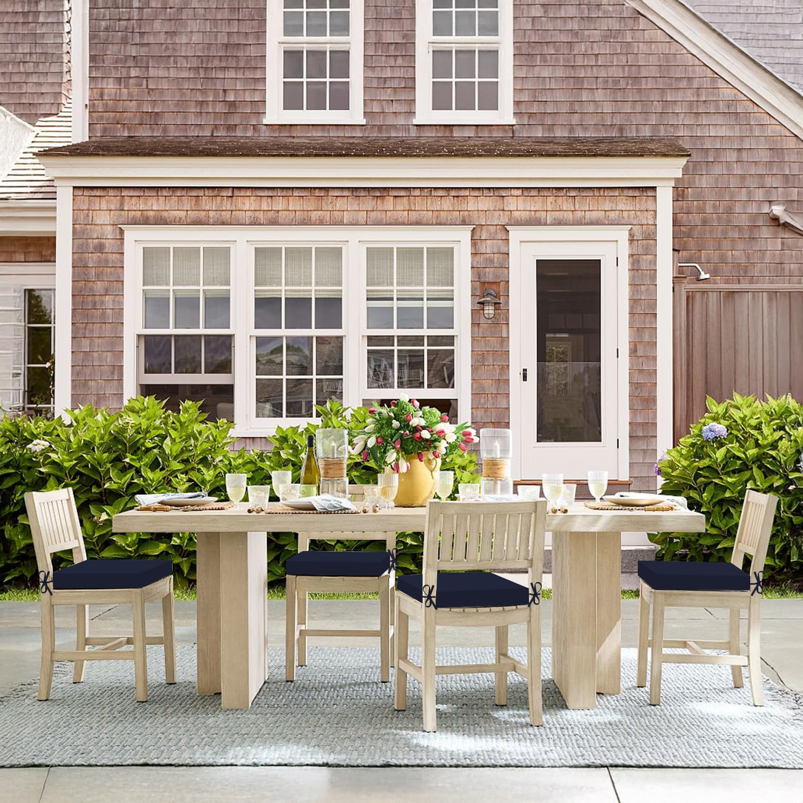 Basic Beyond cushions on outdoor table set creating a cozy patio look