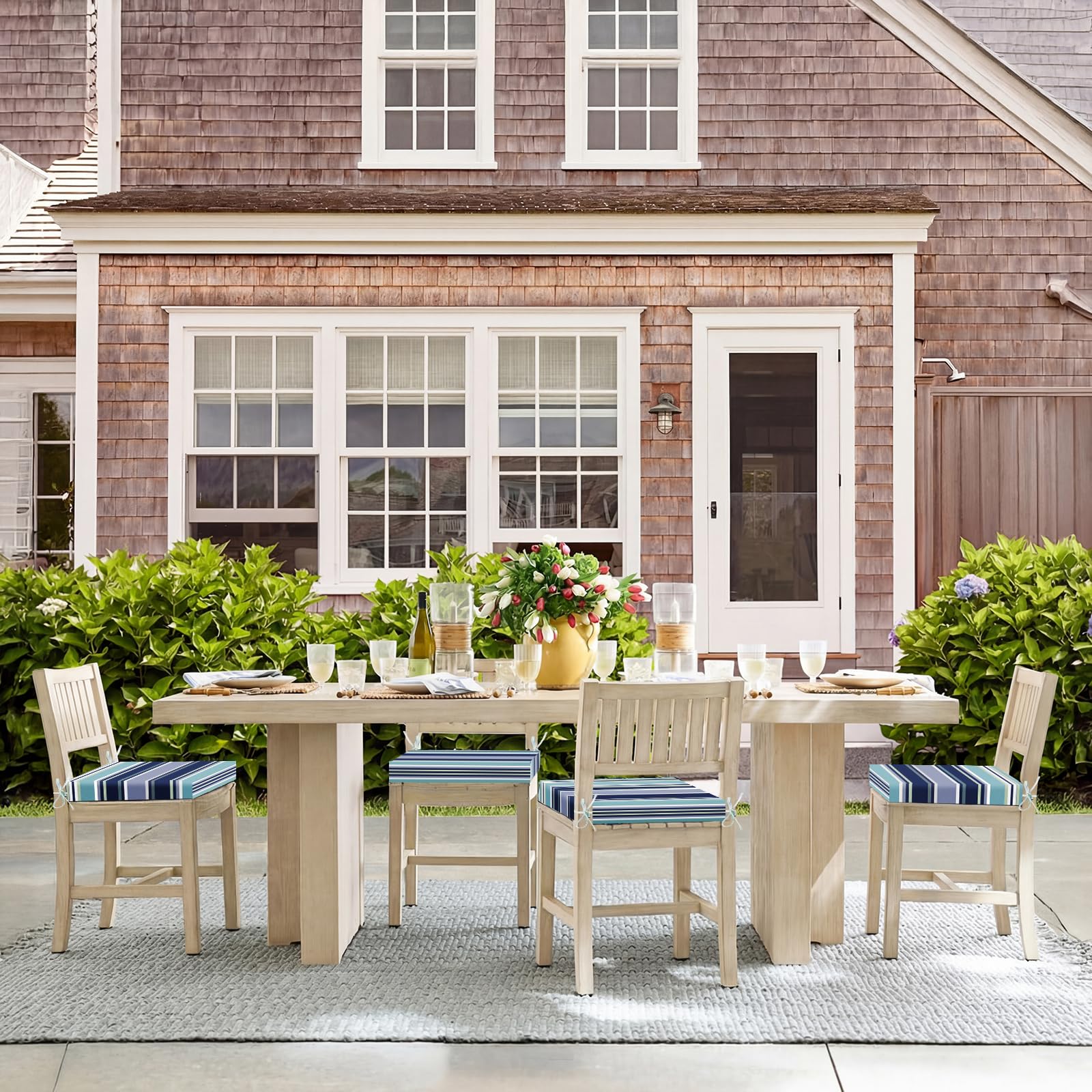 Basic Beyond cushions on a porch at dusk showing relaxed outdoor comfort benefit