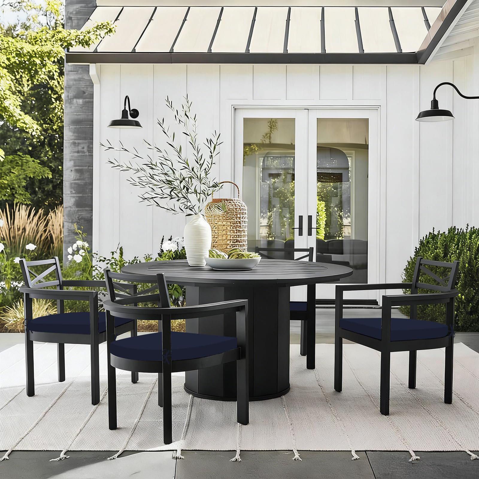 Basic Beyond lifestyle porch scene with cushions on chairs showing coordinated outdoor style