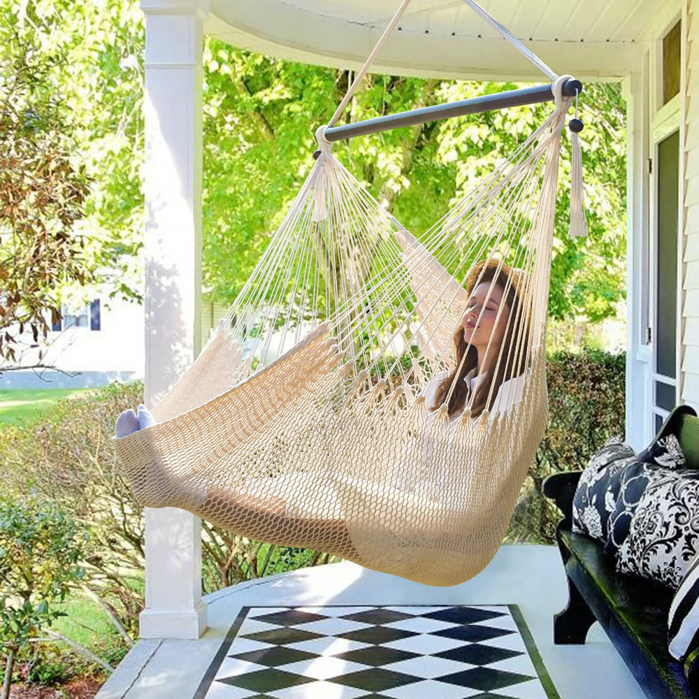 Bathonly hammock chair front view showing beige fabric and wooden bar, stylish comfort