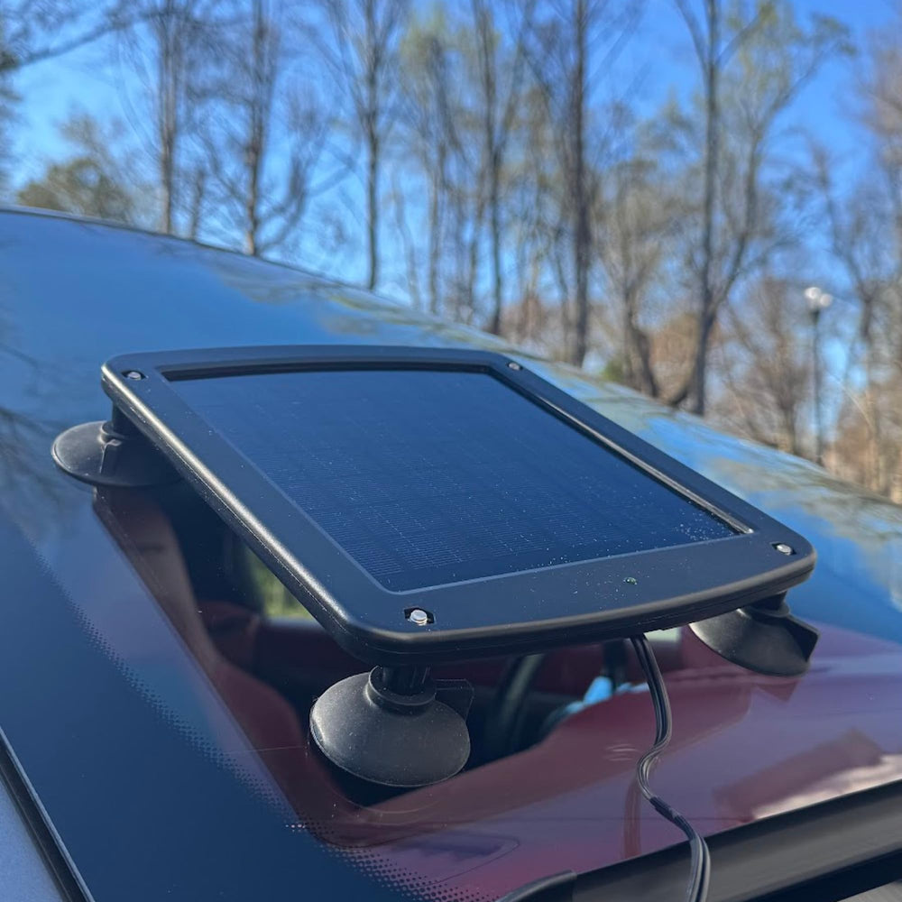 Battery Tender mounted on windshield with cord to cigarette outlet benefit: easy setup