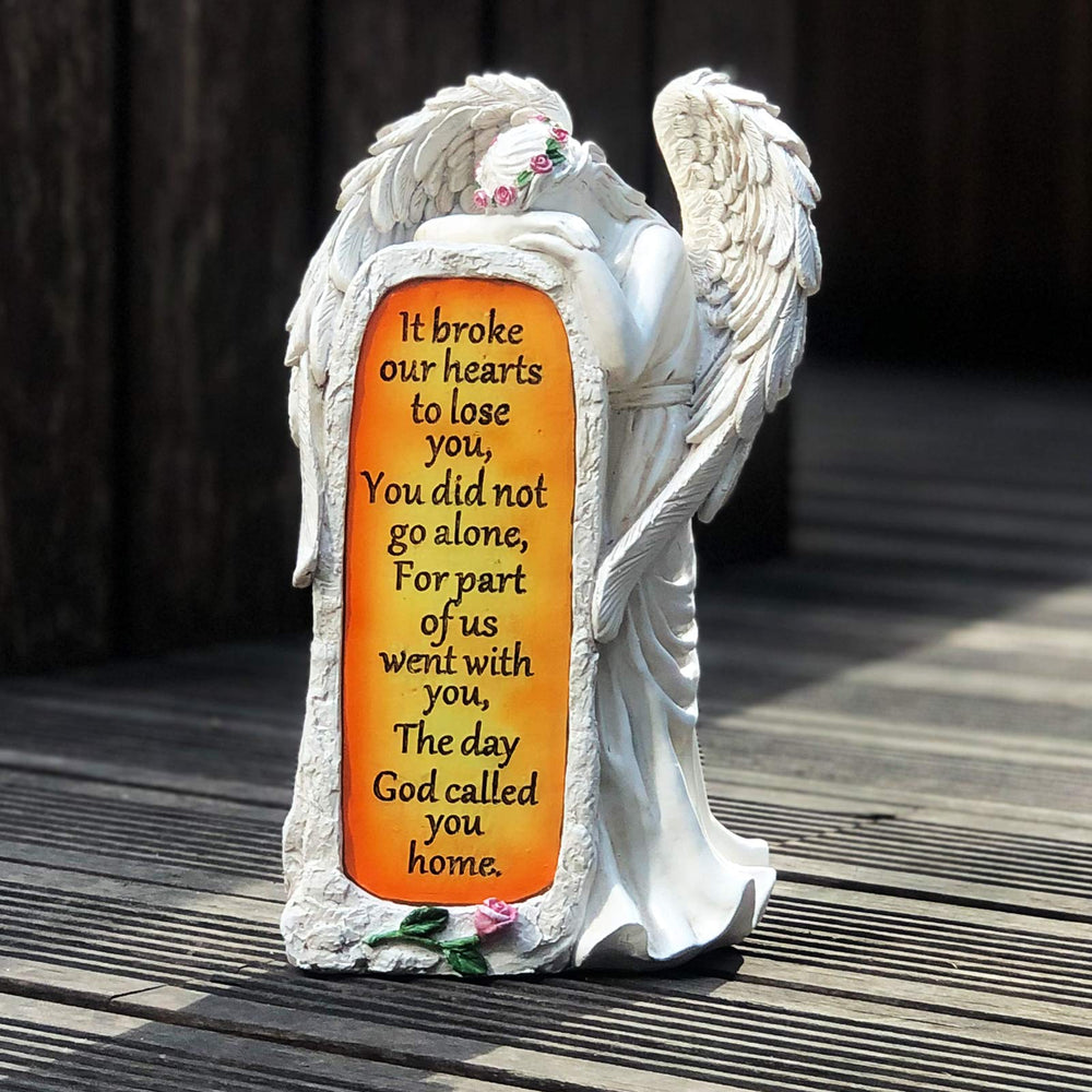 BAYN angel statue placed in a garden providing soft evening illumination
