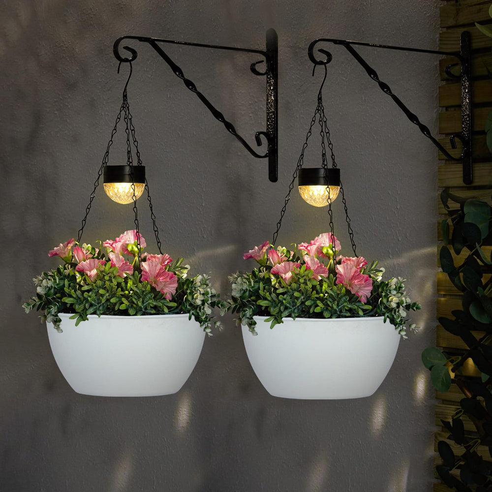 BAYN porch scene at dusk with lit hanging planters creating warm ambient lighting