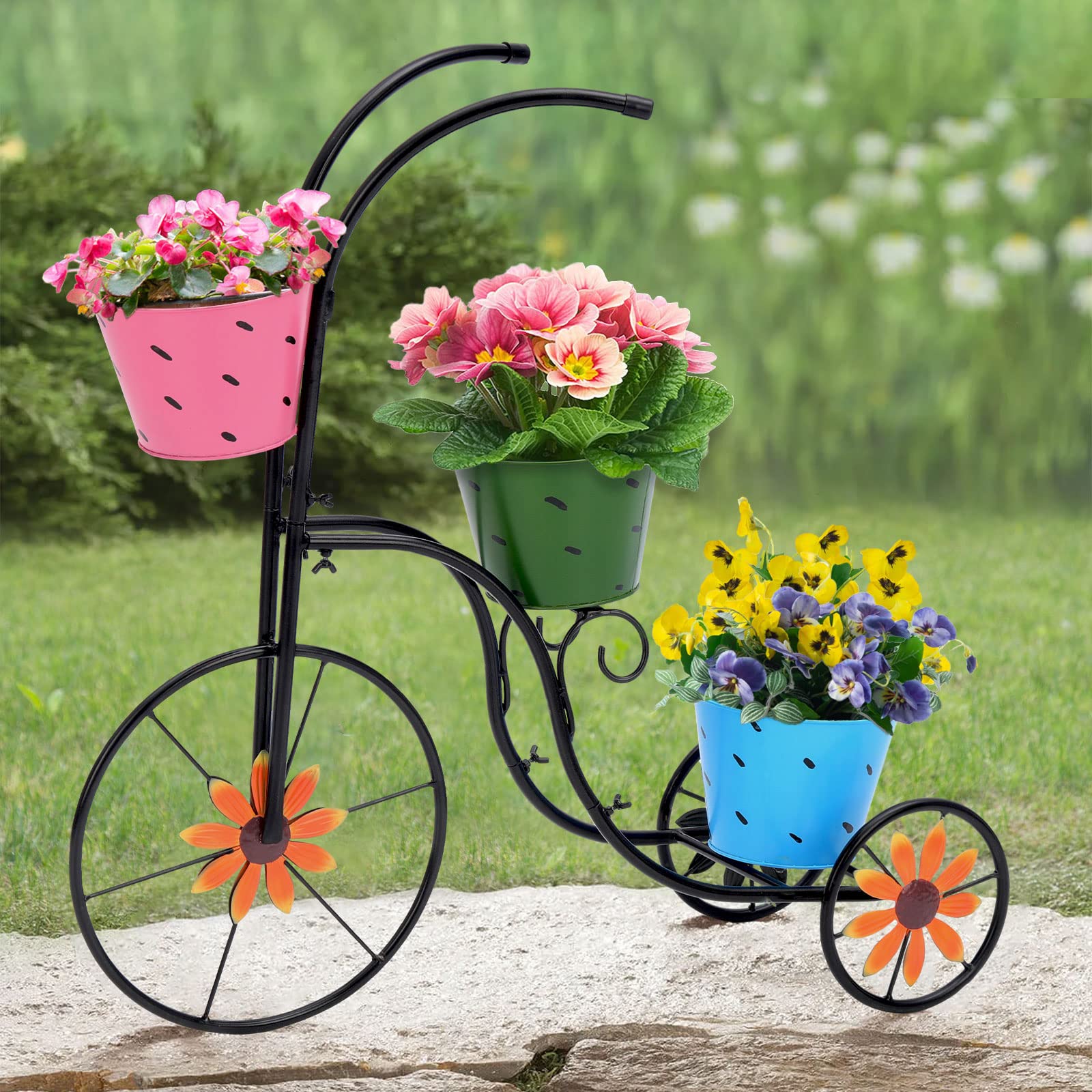 BAYN tricycle planter in garden setting displaying seasonal flower arrangement inspiration