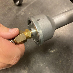 Bayou Classic hose fitted to outdoor fryer demonstrating secure connection