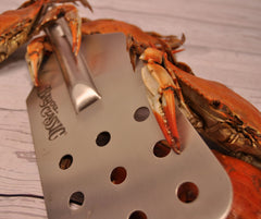 Bayou Classic close-up of 4-inch perforated paddle holes showing efficient liquid circulation benefit