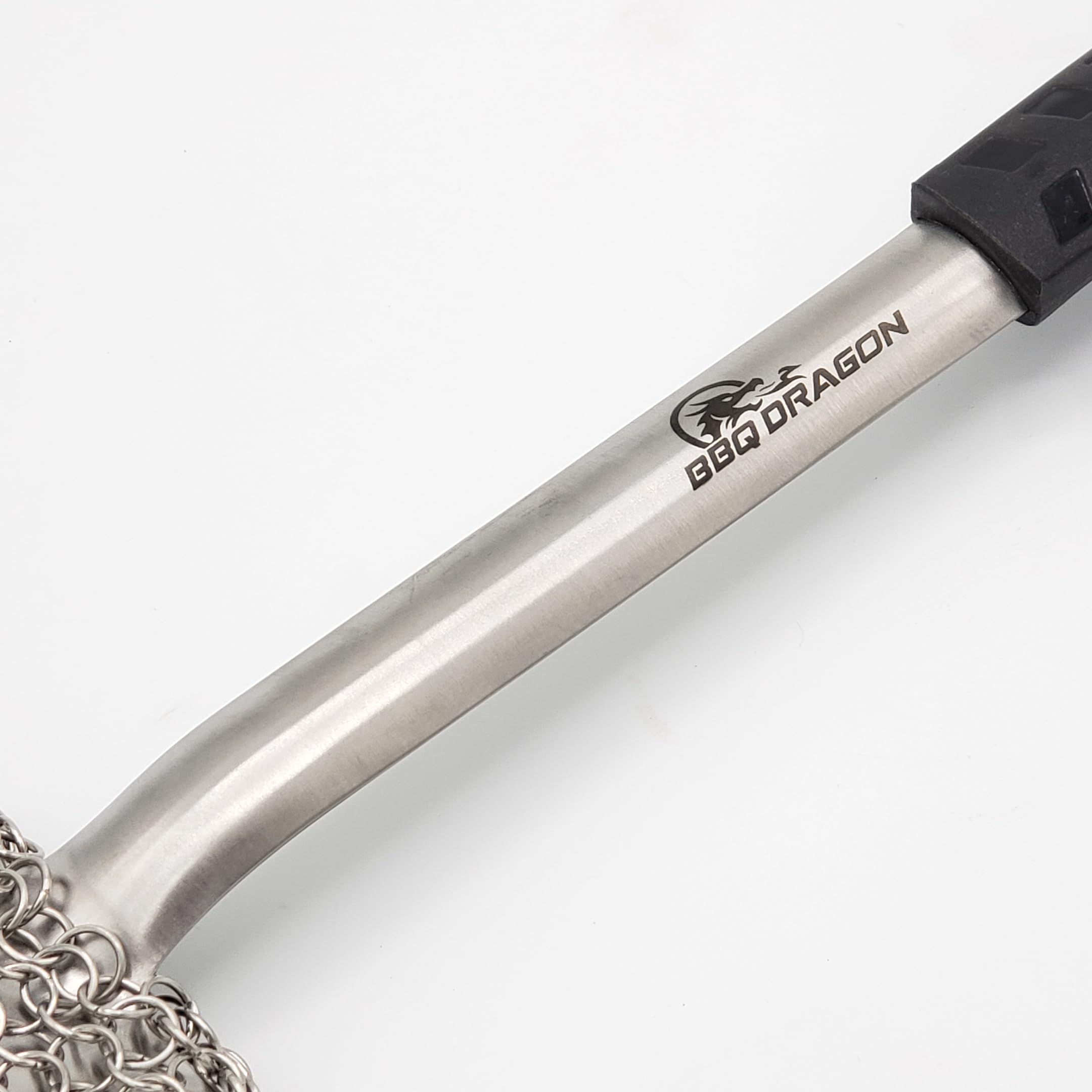 BBQ Dragon brush cleaning a hot grill demonstrating fast removal of charred food
