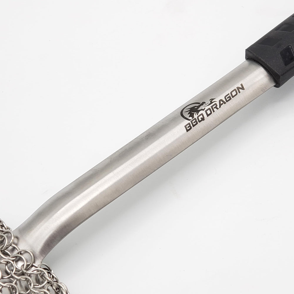BBQ Dragon brush cleaning a hot grill demonstrating fast removal of charred food