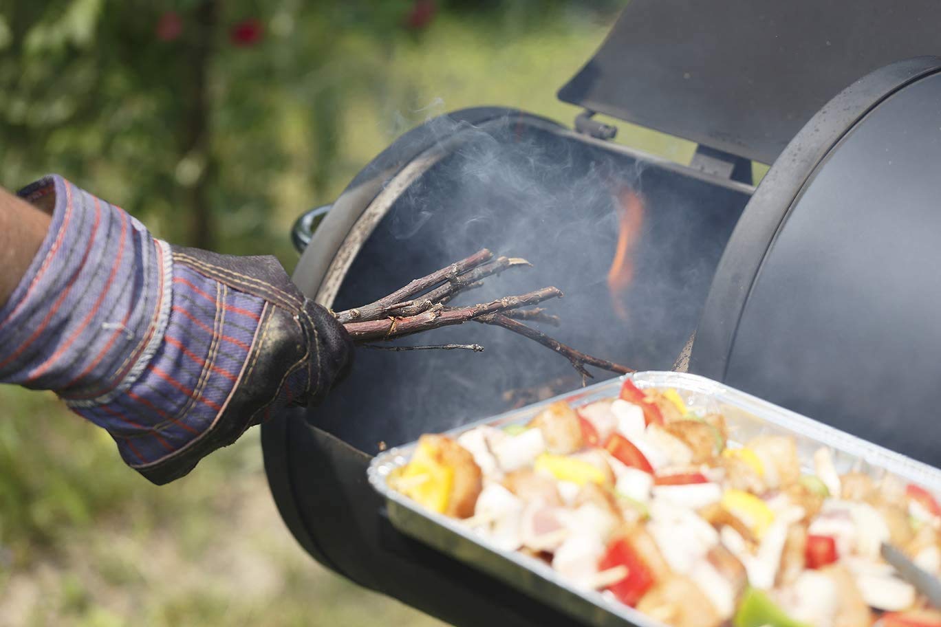BBQ-PLUS maze bars in smoker during cook showing extended burn time benefit