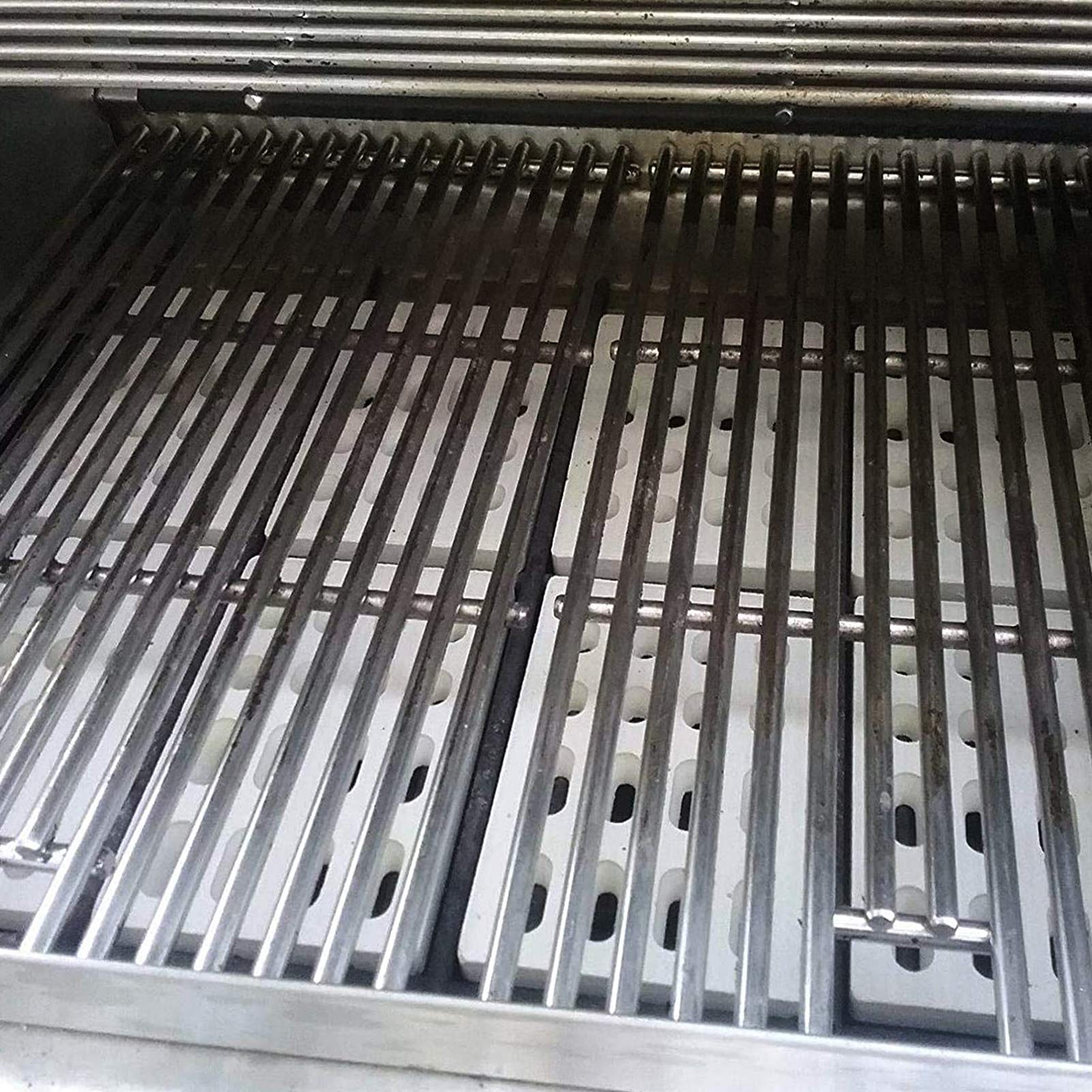 bbq777 briquette placed next to ruler to confirm the 7 1/16" × 4 3/4" size and fit