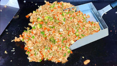 BBQMFG tongs in use picking up food for better grip and control