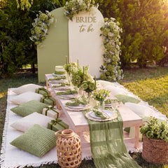 Beeveer sage green table runner styled on a wooden table adding rustic elegance