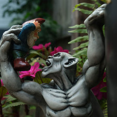 BELLA HAUS DESIGN side profile showing two gnomes gripped by the gargoyle for humor