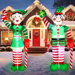 Bencailor front view of both 8ft elves showing bright holiday display