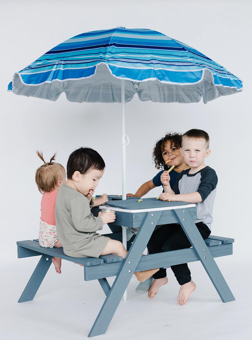 Beright children using sand and water bins for engaging sensory play