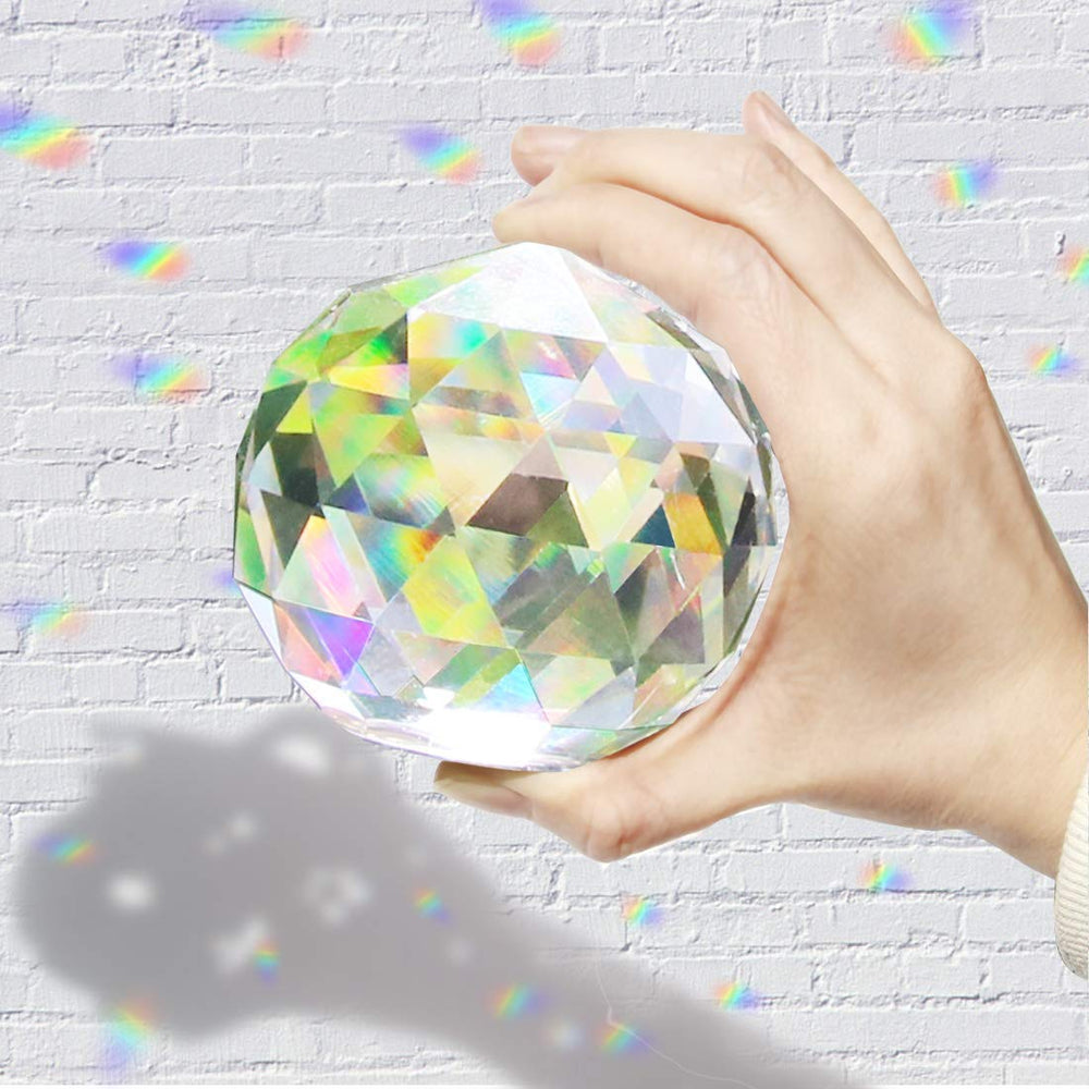 Besimple hanging in window casting colorful rainbow beams to brighten room