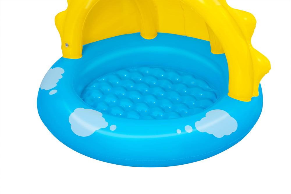 Bestway pool next to adult hands showing compact size and easy handling