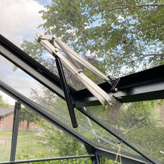 BIBISTORE mounted on wooden greenhouse lid showing easy installation and hands-free ventilation
