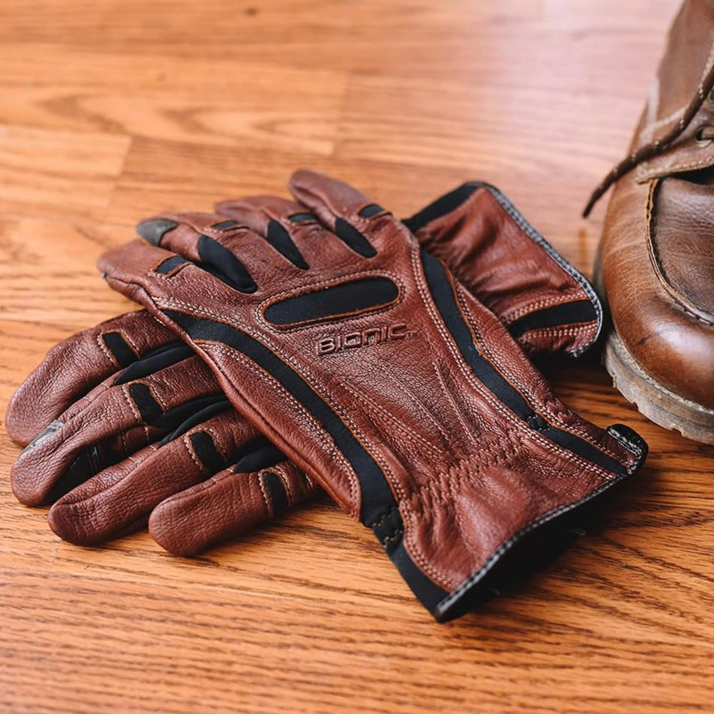 Bionic glove next to a hand for size comparison showing natural fit and dexterity