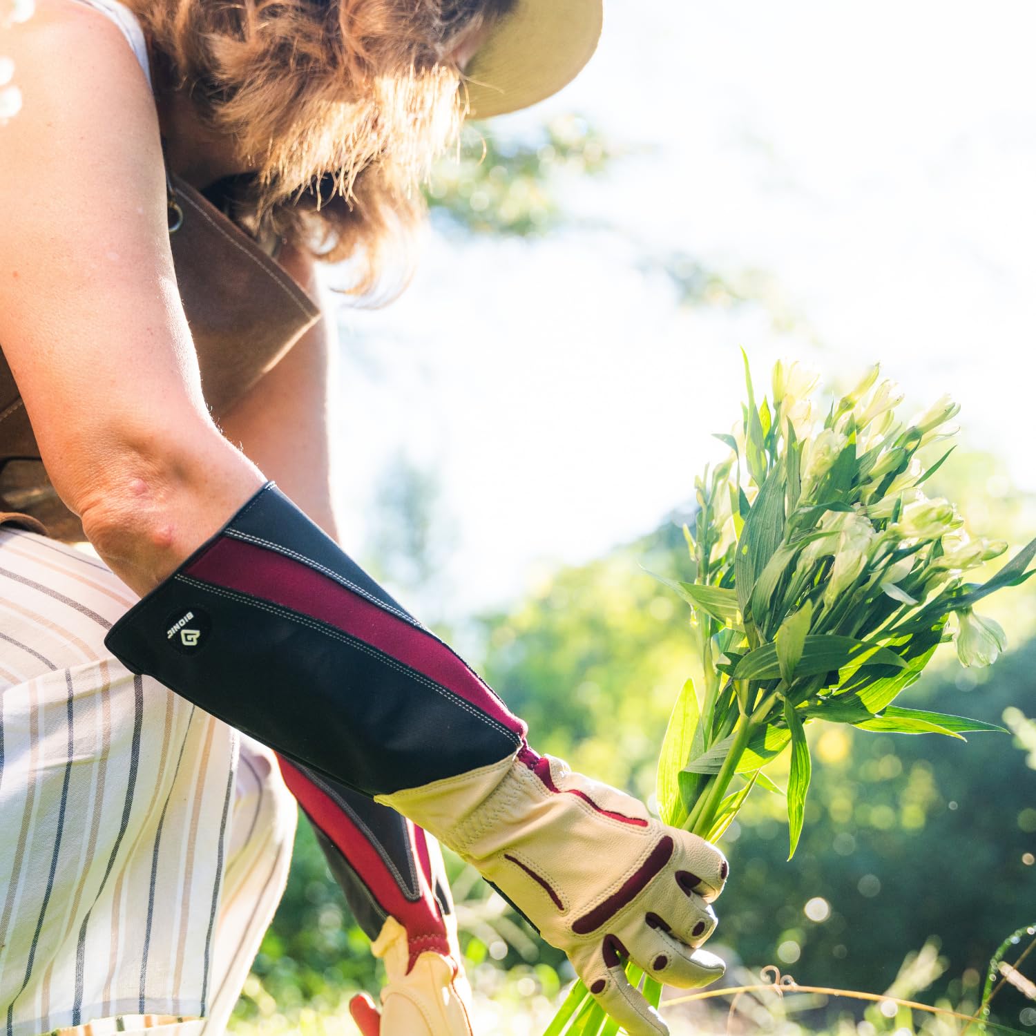 Bionic gloves worn while pruning roses demonstrating protection and dexterity