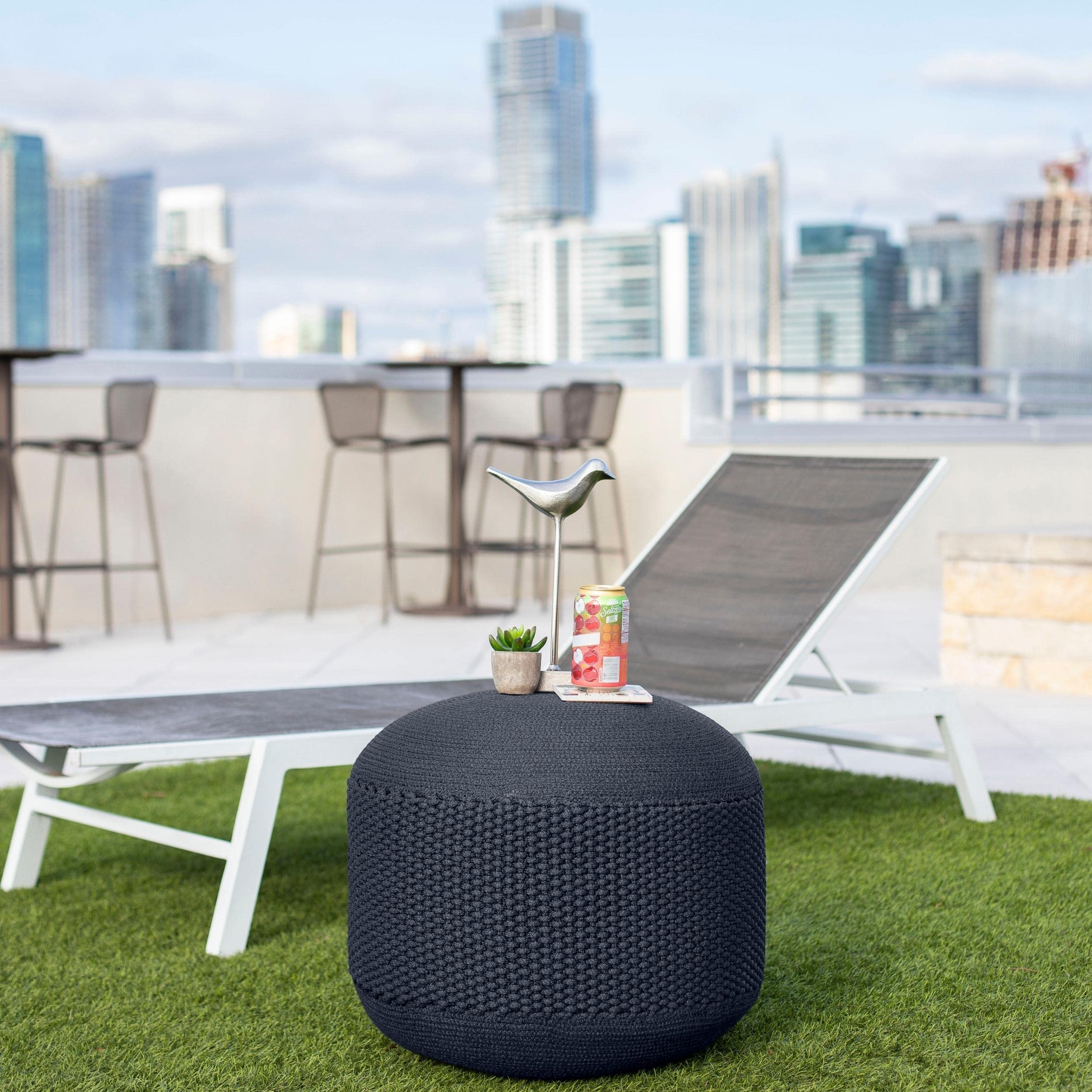 BIRDROCK HOME navy pouf with water splashes showing water-resistant benefit