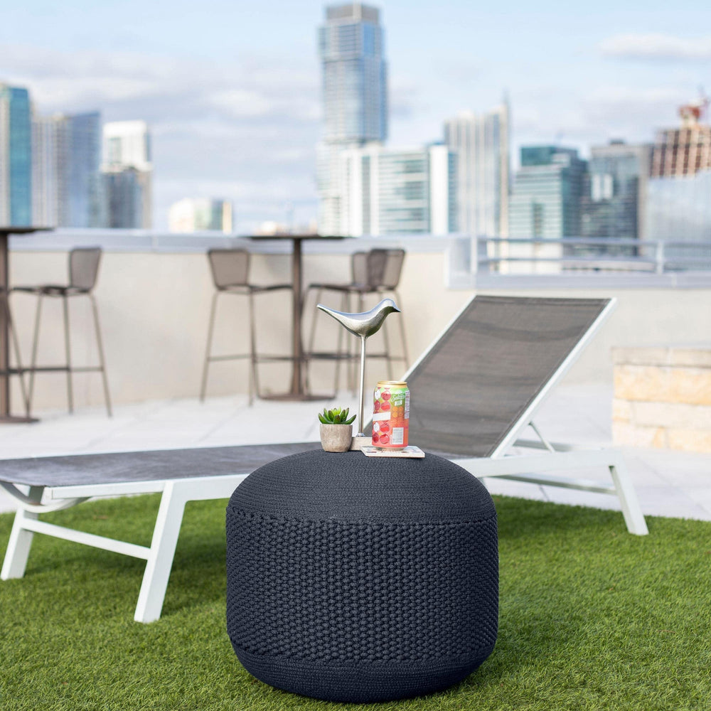 BIRDROCK HOME navy pouf with water splashes showing water-resistant benefit