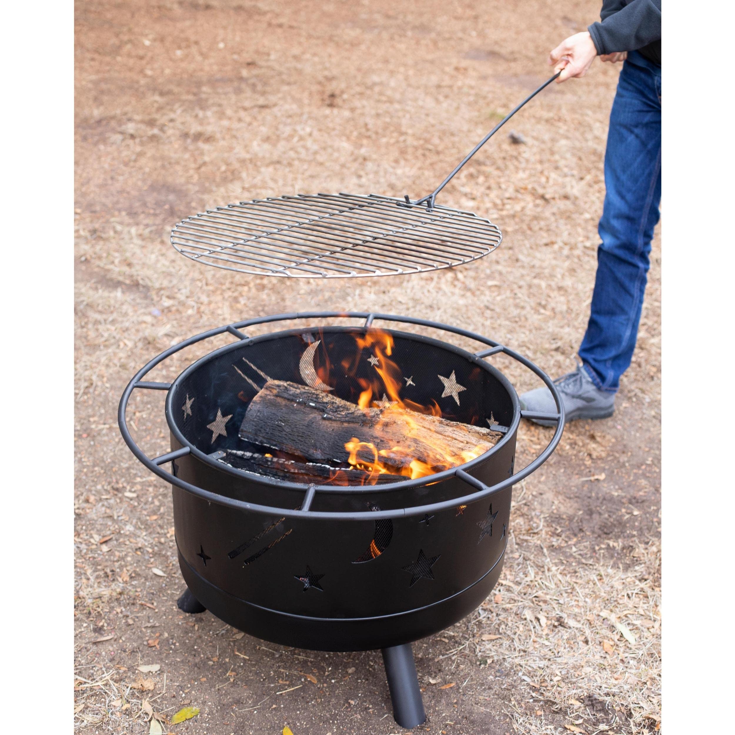 BIRDROCK HOME fire pit next to patio chair for size comparison and convenient portability