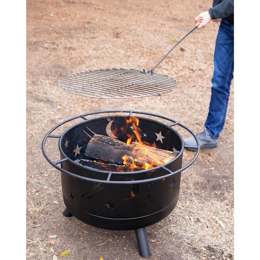 BIRDROCK HOME fire pit next to patio chair for size comparison and convenient portability