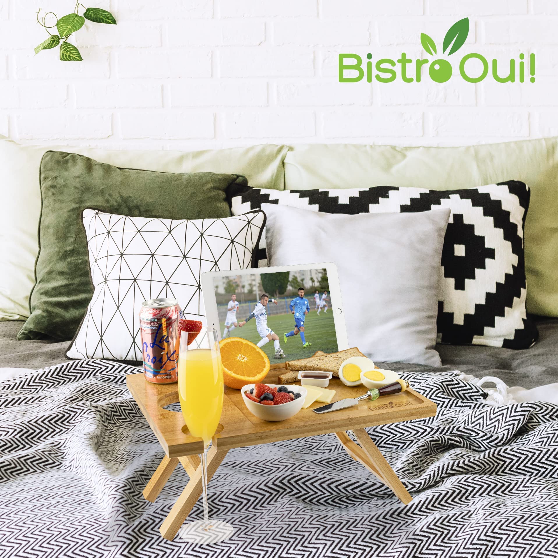 Bistro Oui! held in hand to show compact size and portability