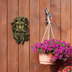 Bits and Pieces mounted on tree trunk adding whimsical outdoor personality