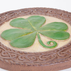 Bits and Pieces shamrock hung on fence demonstrating easy wall display and decorative use