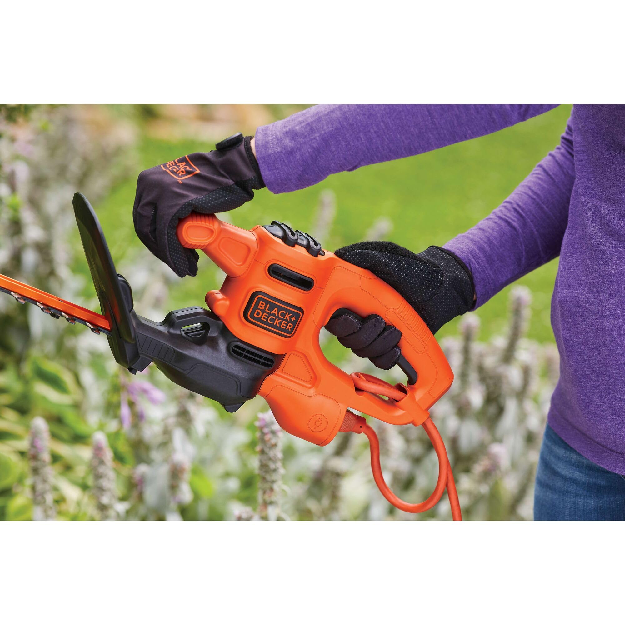 BLACK+DECKER trimmer in garden setting demonstrating tidy hedge results