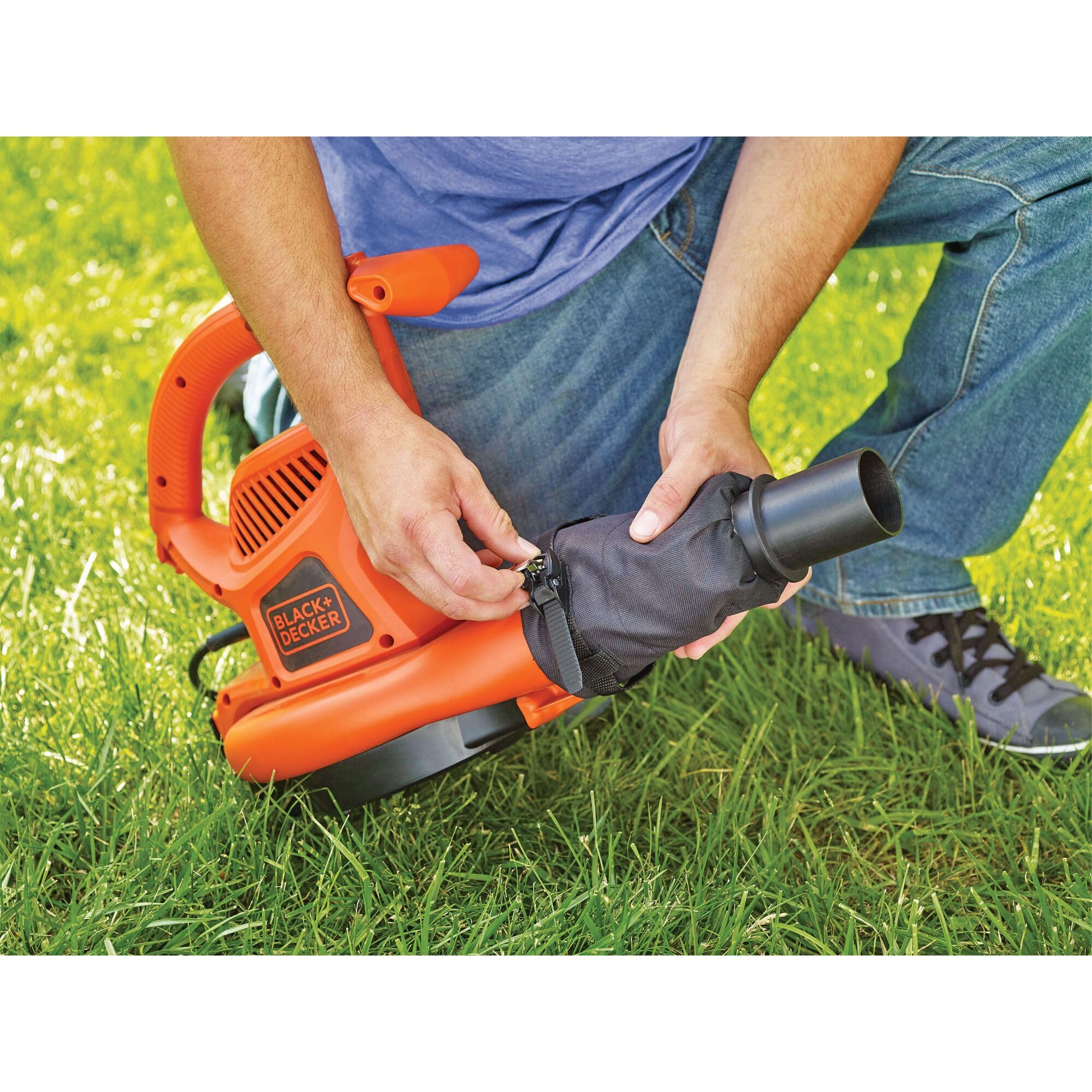 BLACK+DECKER attachment in use clearing gutter from ground showing safe operation benefit