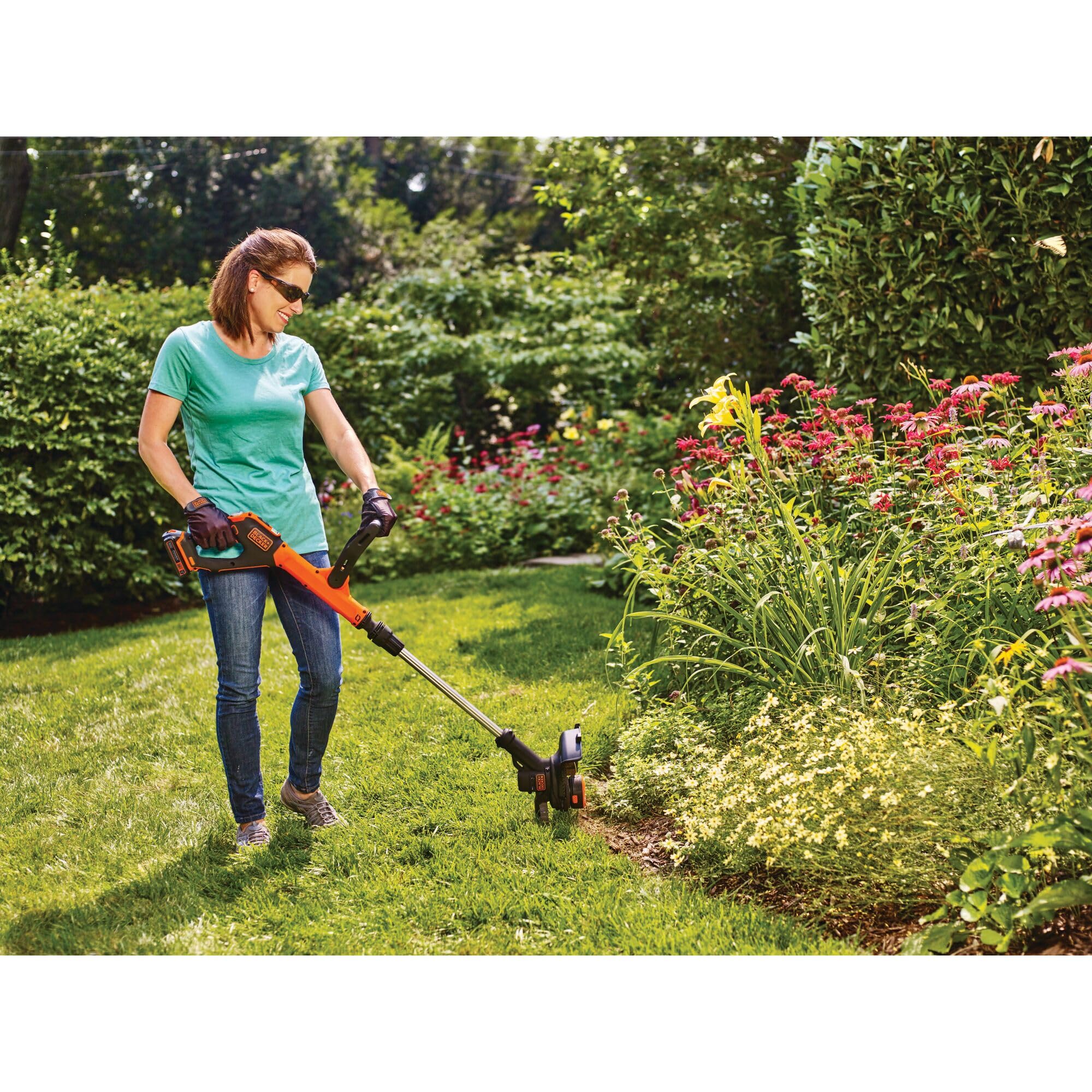 BLACK+DECKER lifestyle scene trimming lawn edges showing quick yard maintenance benefit