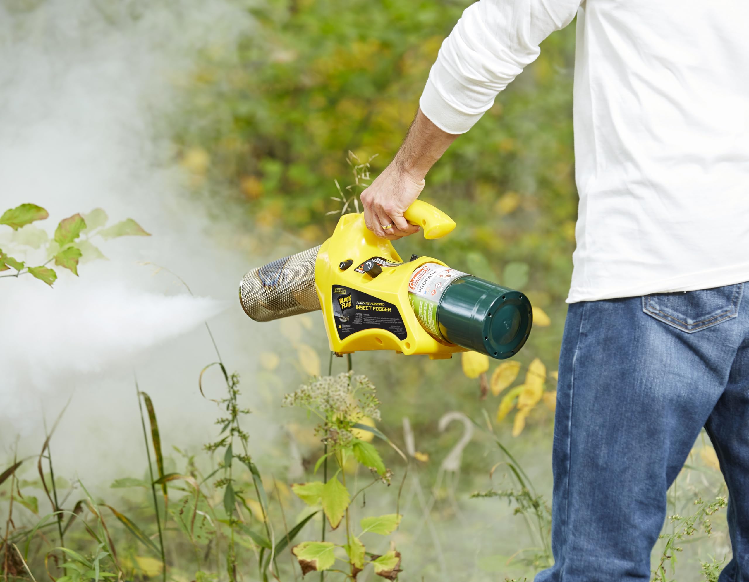 Black Flag fogger in use over a backyard patio demonstrating fast insect clearing
