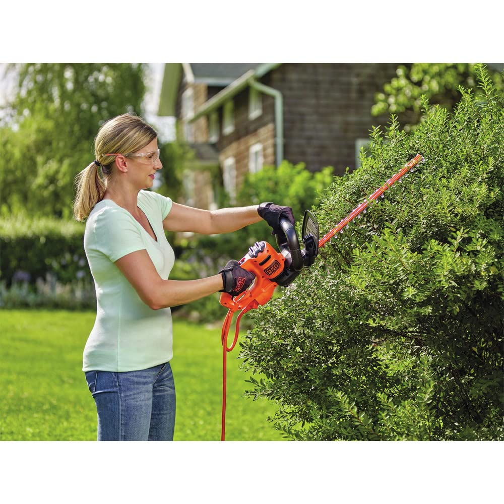 BLACK+DECKER trimmer cutting a hedge for quick, even shaping benefit