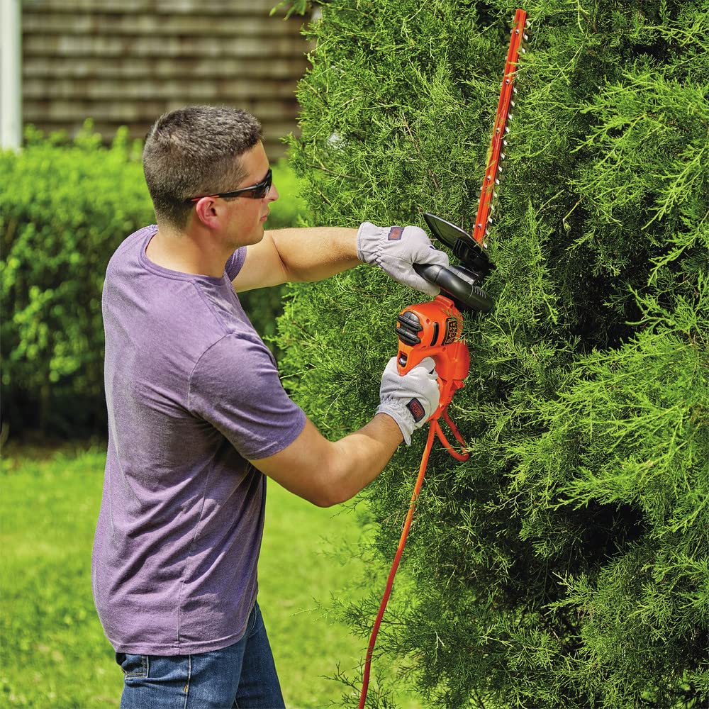 BLACK+DECKER held by hand showing scale for lightweight, easy maneuvering