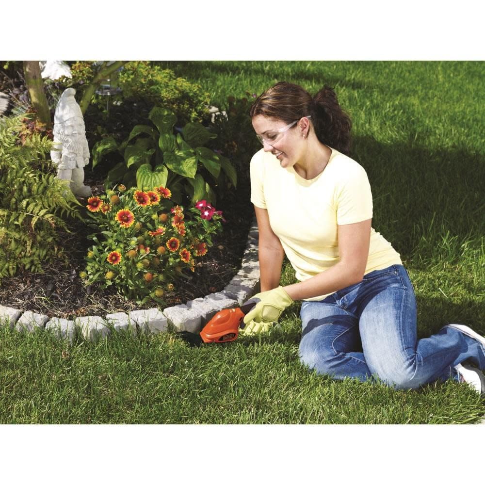 BLACK+DECKER held in hand to show scale and lightweight 1.4-pound benefit