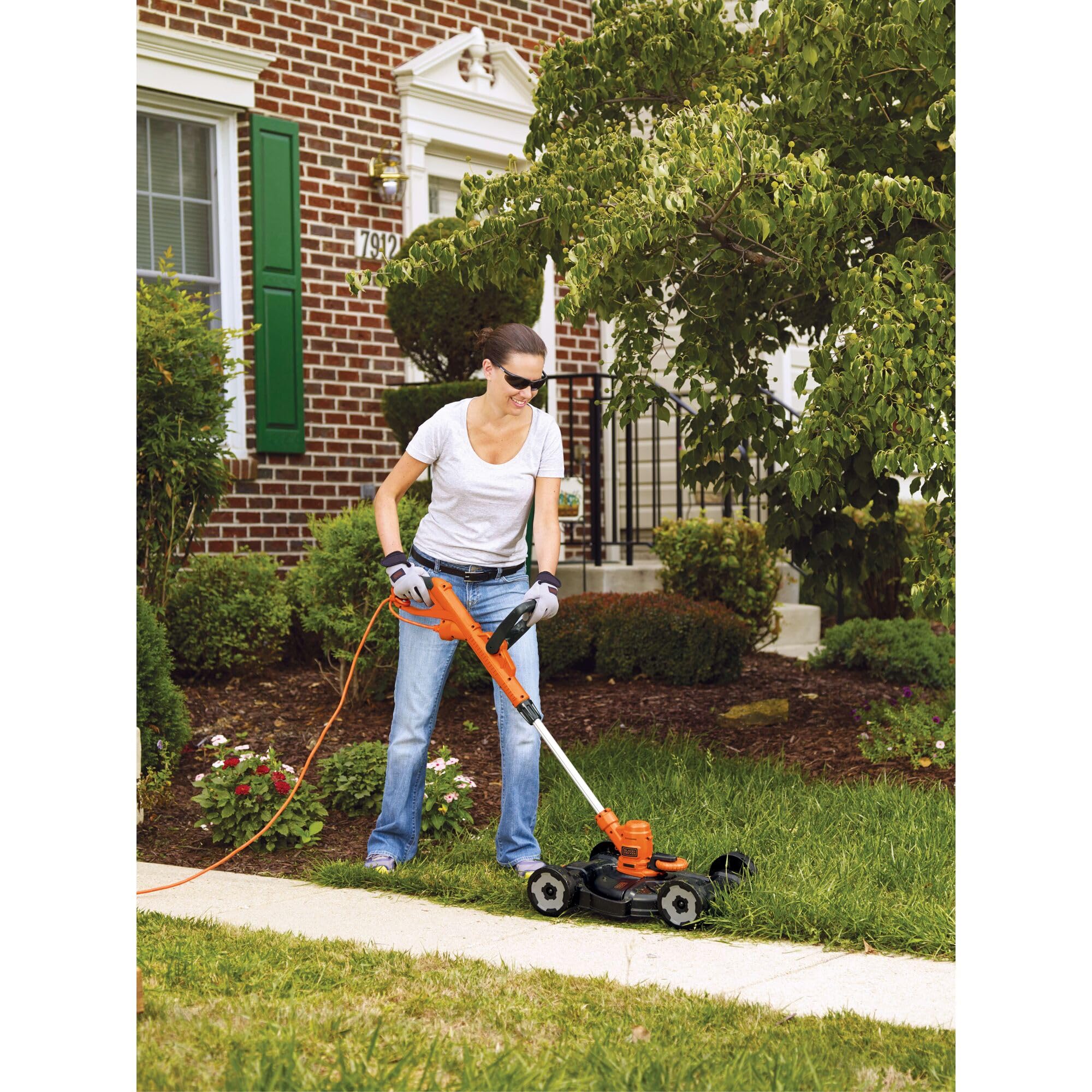 BLACK+DECKER height adjustment lever close view showing easy cutting-height customization